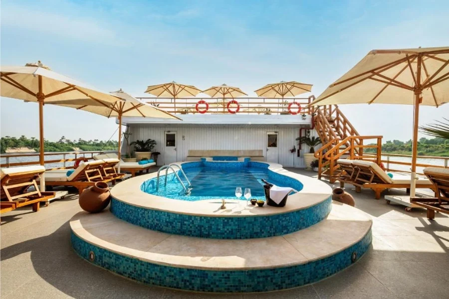 Swimming pool and loungers on the cruise sun deck