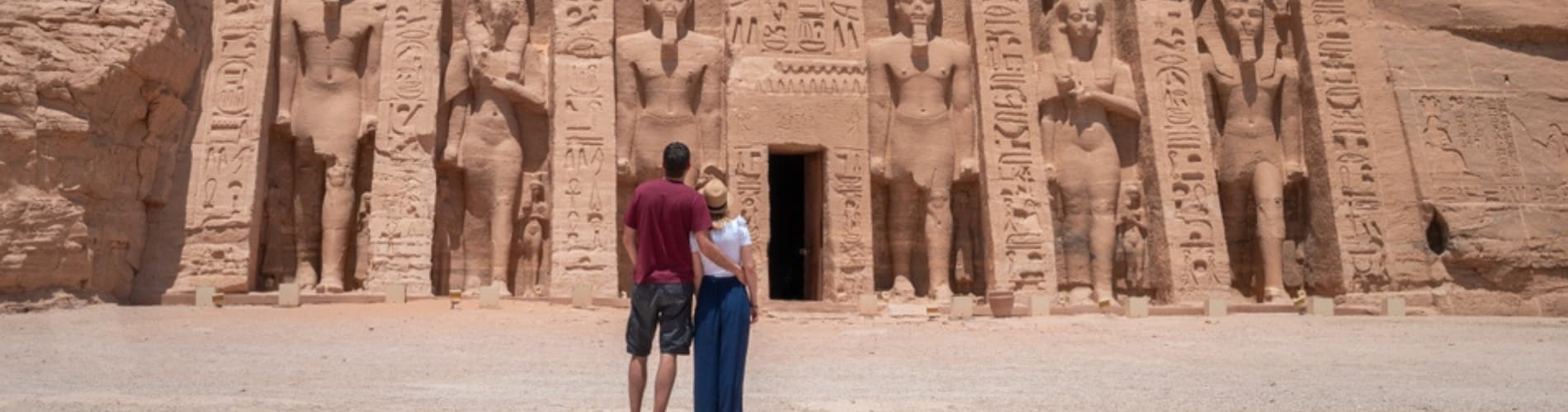 Couple standing in front of Abu Simbel Temple