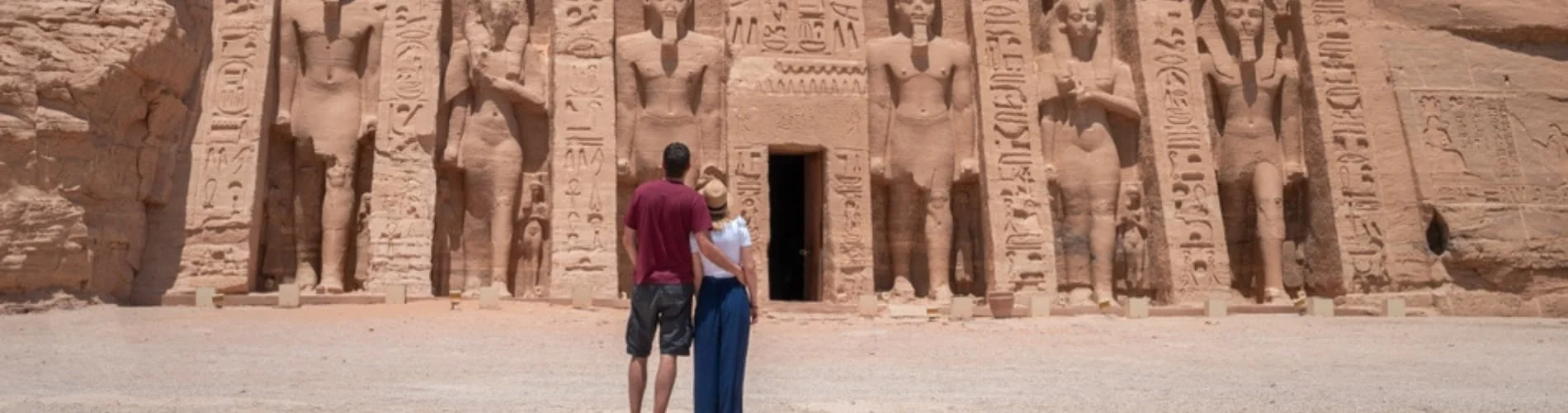 Couple standing in front of Abu Simbel Temple