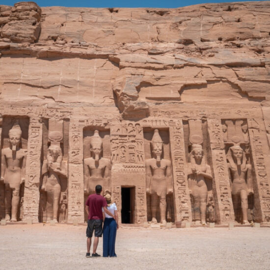 Couple standing in front of Abu Simbel Temple