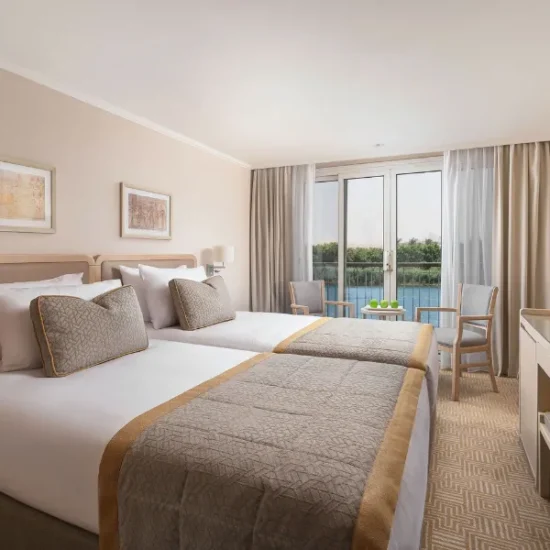 JAZ Viceroy Nile Cruise cabin with twin beds and Nile River view