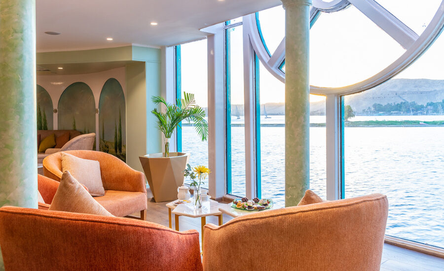 Outdoor seating area with Nile views aboard the cruise