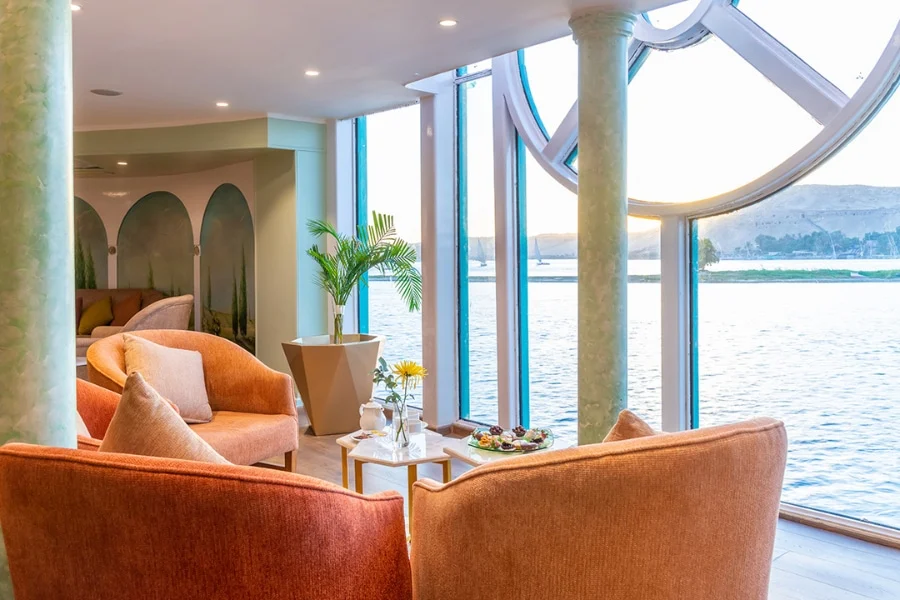Outdoor seating area with Nile views aboard the cruise