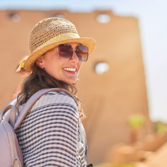 Tourist standing in front of Edfu Temple