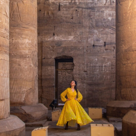 Tourist in a dress at Edfu Temple