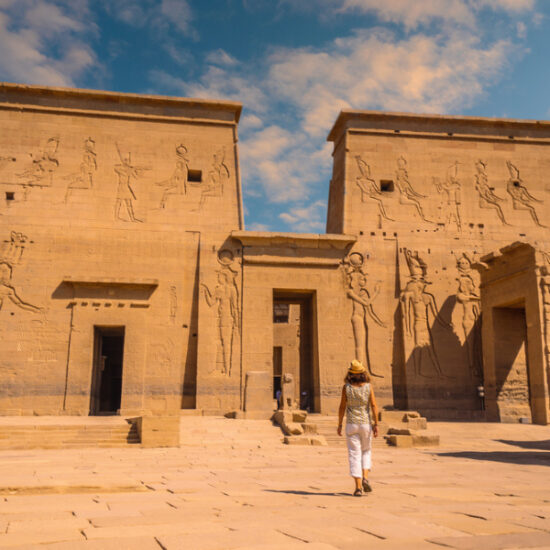 Tourist walking near Philae Temple in Aswan